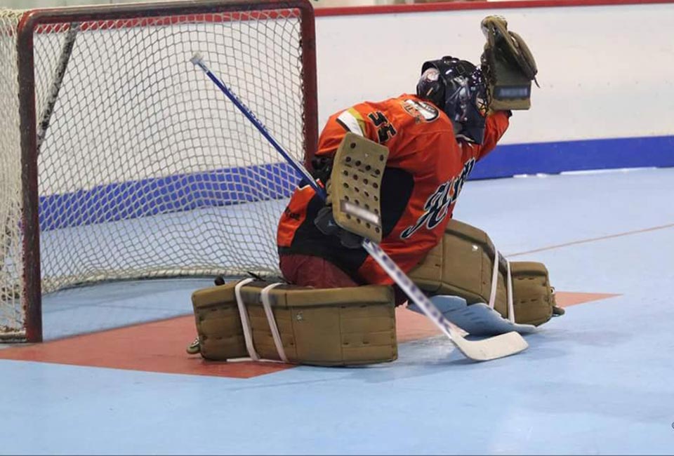 image of goalie making a save with Rollerflys
		